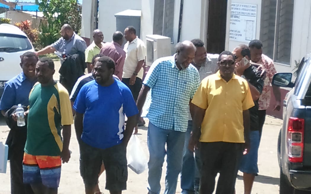 Tony Nari, Serge Vohor (middle) and lawyer Robin Kababa outside court on Tuesday.