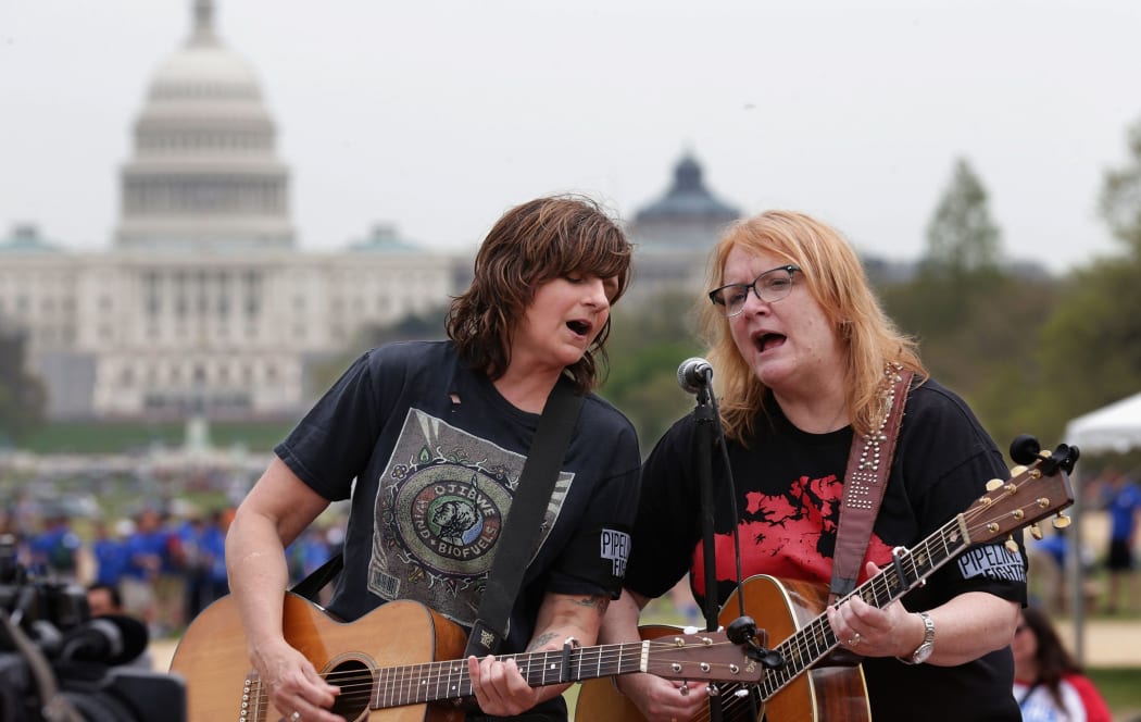 Amy Ray, left, and Emily Saliers of The Indigo Girls perform in the National Mall in Washington DC, US.