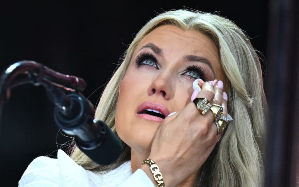 Erika Kirk, Charlie Kirk's widow, wipes away tears as she speaks at the public memorial service for right-wing activist Charlie Kirk at State Farm Stadium in Glendale, Arizona, on 21 September, 2025.
