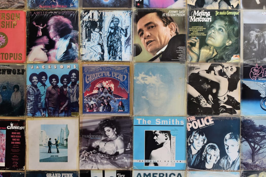 Wall decorated with vintage vinyl records album sleeves.