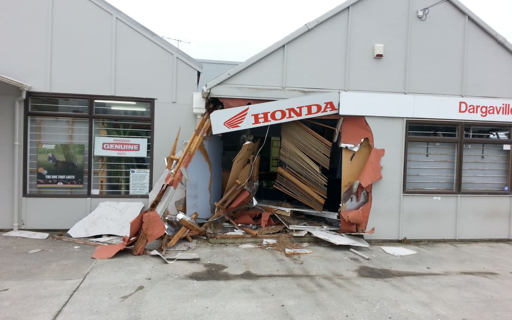 The early morning smash left a gaping hole in the motorcycle dealership building.
