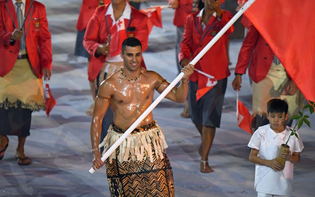 Pita Taufatofua leads Tonga's delegation during the Olympics.