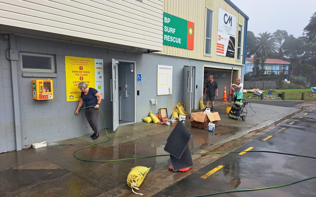 The clean-up at Waihi Beach Surf Life Saving Club after the flood.