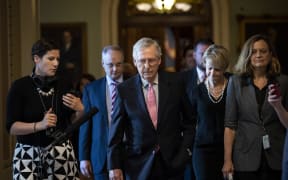 Senate Majority Leader Mitch McConnell  leaves the Senate floor and walks to his office on Capitol Hill.