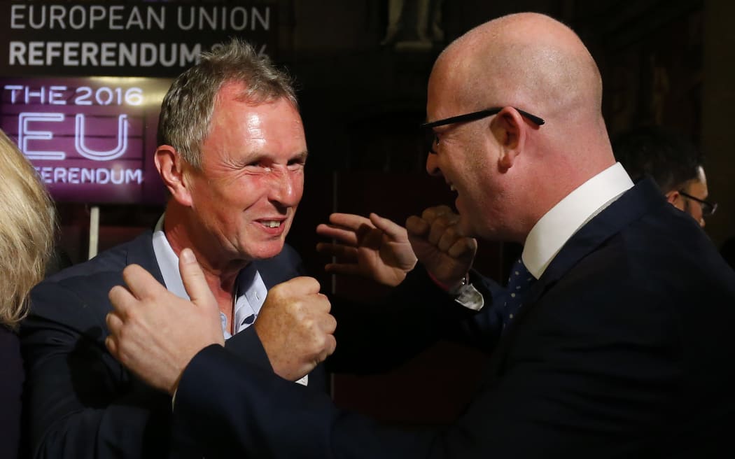 UKIP MEP Paul Nuttall, right, and Conservative MP Nigel Evans celebrate the likely victory of 'Leave'.
