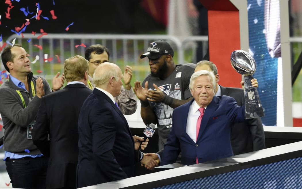 Robert Kraft owner of the New England Patriots raises the Vince Lombardi Trophy after the Patriots defeat the Atlanta Falcons 34-28 in overtime of Super Bowl 51 at NRG Stadium on February 5, 2017 in Houston, Texas.