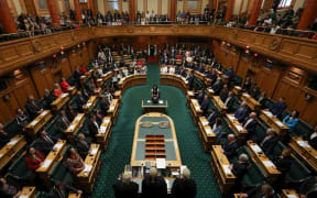 MPs at the official opening of Parliament. with the Clerk of the House presiding over the swearing in of MPs and election of the Speaker.