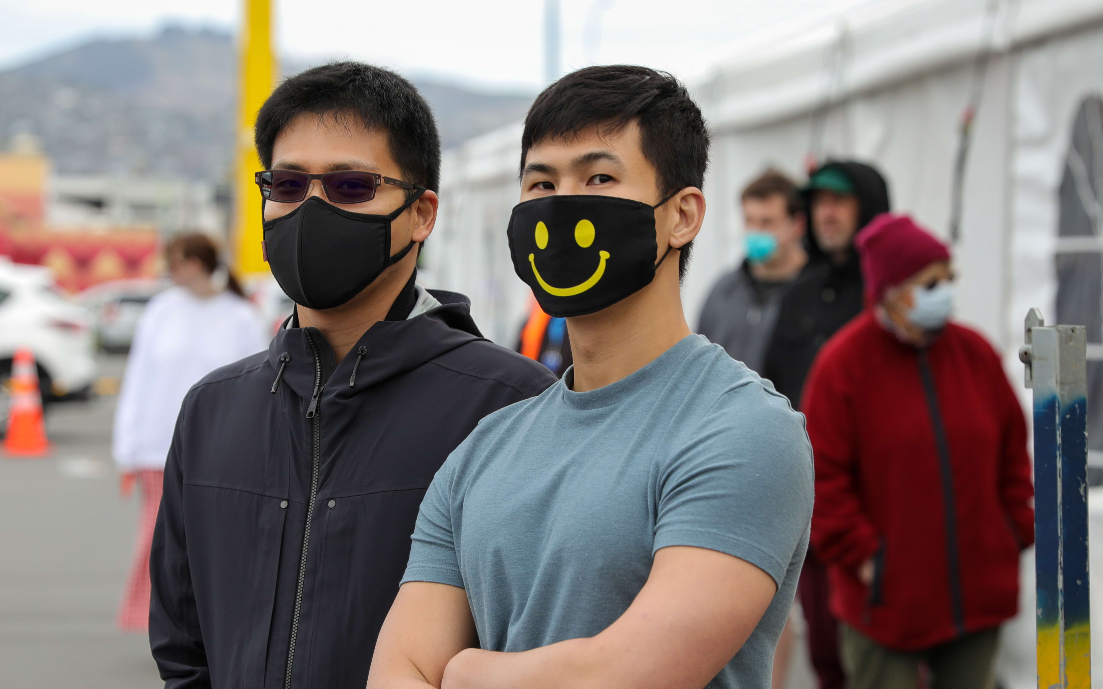 People wearing masks line up at Christchurch's mobile testing station for Covid-19 coronavirus at Pak n Save on Moorhouse Ave.