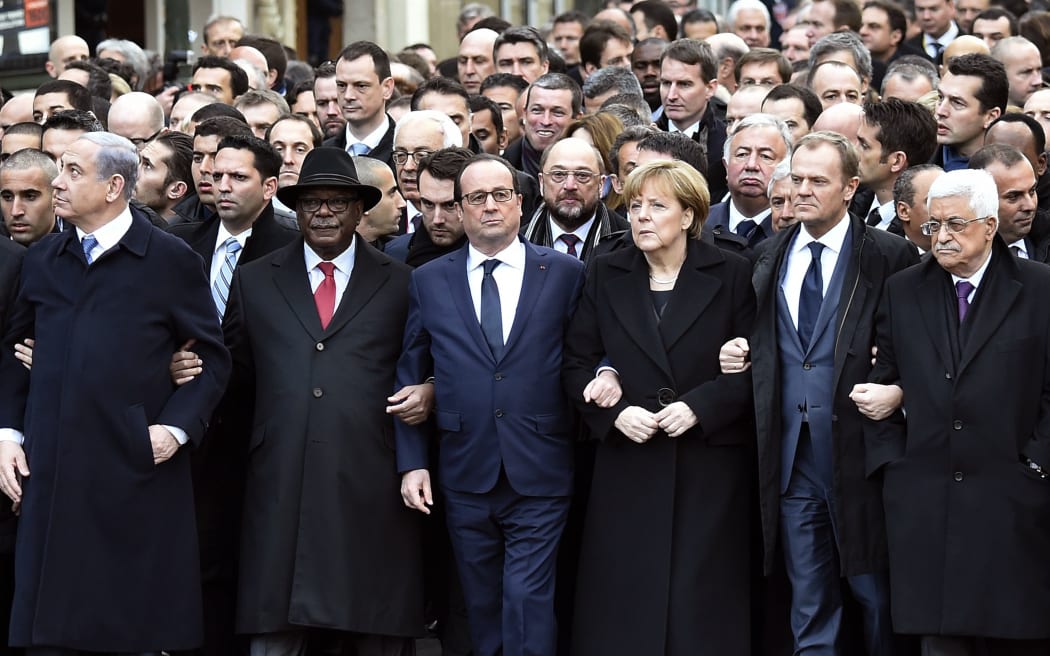 Israeli Prime Minister Benjamin Netanyahu (left), Malian President Ibrahim Boubacar Keita, French President Francois Hollande, German Chancellor Angela Merkel, EU President Donald Tusk and Palestinian president Mahmoud Abbas march in the unity rally.