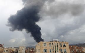 Smoke billows after an Israeli airstrike on Yemen's Houthi-held capital Sanaa on 24 August.