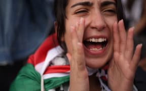 A protester shouts slogans during the "National March on Washington: Free Palestine" at the Freedom Plaza while calling for a ceasefire between Israel and Hamas on 4 November.
