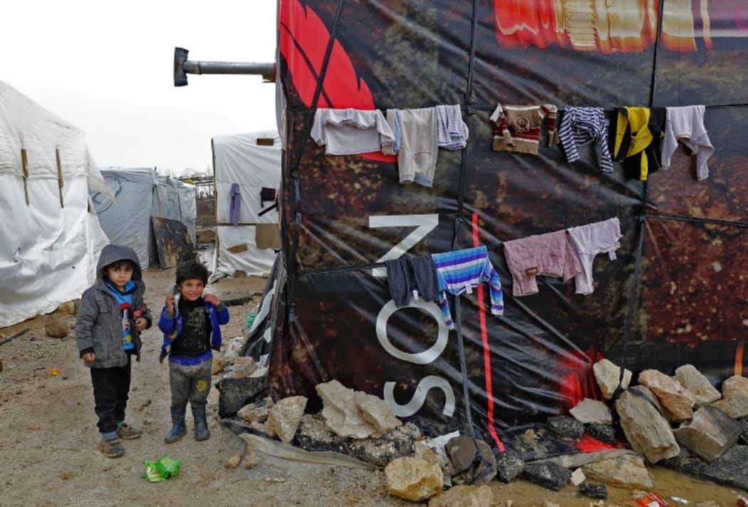 Syrian children at an unofficial refugee camp in the village of Deir Zannoun in Lebanon's Bekaa valley.