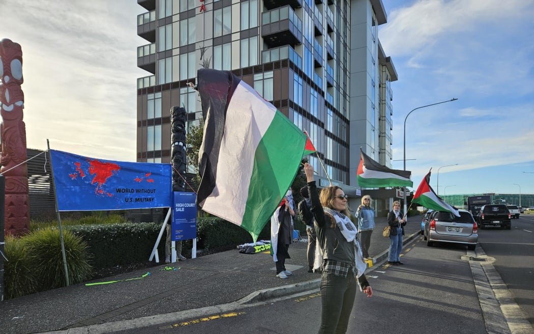 A small group of pro-Palestine protesters outside National's annual party conference.