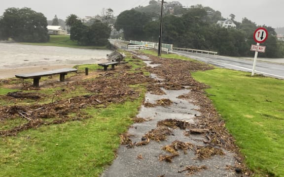 Debris left by the high tide rising above the shoreline in Tairua on 12 February, 2023, as sea surges from Cyclone Gabrielle begin to be seen.