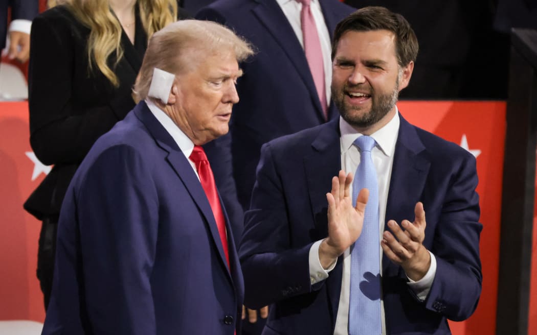 Republican presidential candidate, former US President Donald Trump (L) and Republican Vice Presidential candidate, US Senator JD Vance appear on the first day of the Republican National Convention at the Fiserv Forum on July 15, 2024 in Milwaukee, Wisconsin.