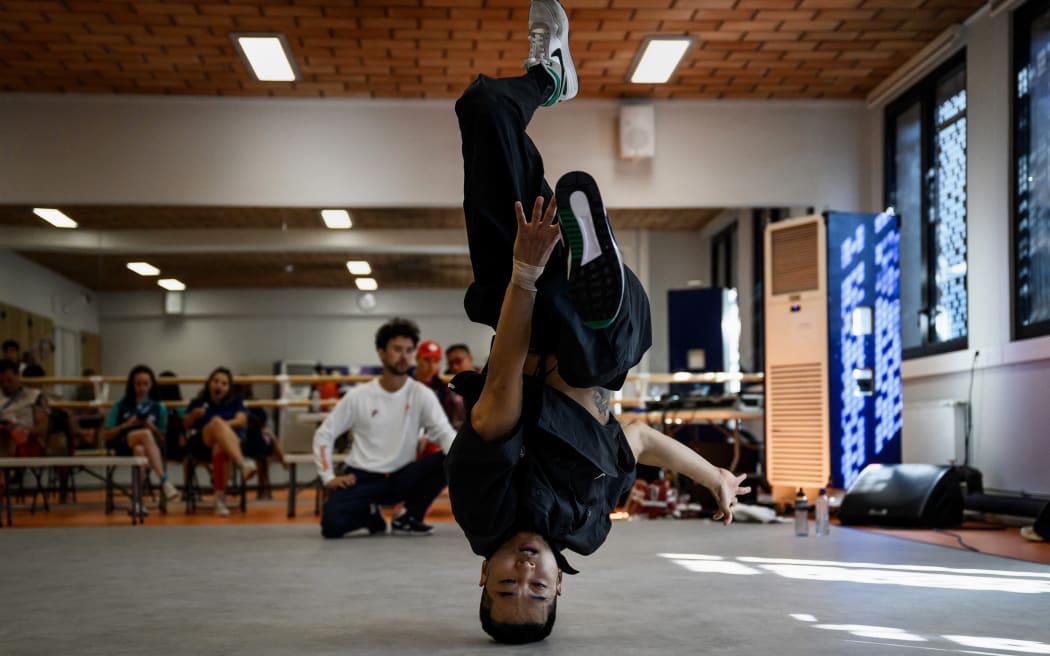 South Korea's Kim Hong-yuk, known as b-boy Hongten, practices during a breaking training session for the Paris 2024 Olympic Games at the Pablo Neruda sport centre in Saint-Ouen on August 6, 2024. (Photo by JEFF PACHOUD / AFP)