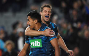 Rieko Ioane scores a try and celebrates with Matt Duffie.