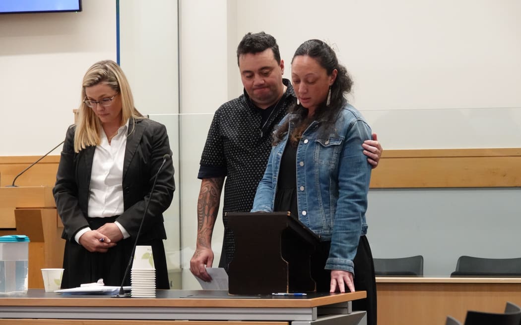 Alicia Toki reads her victim impact statement, with partner Andre Petera and lawyer Ellie Harrison.