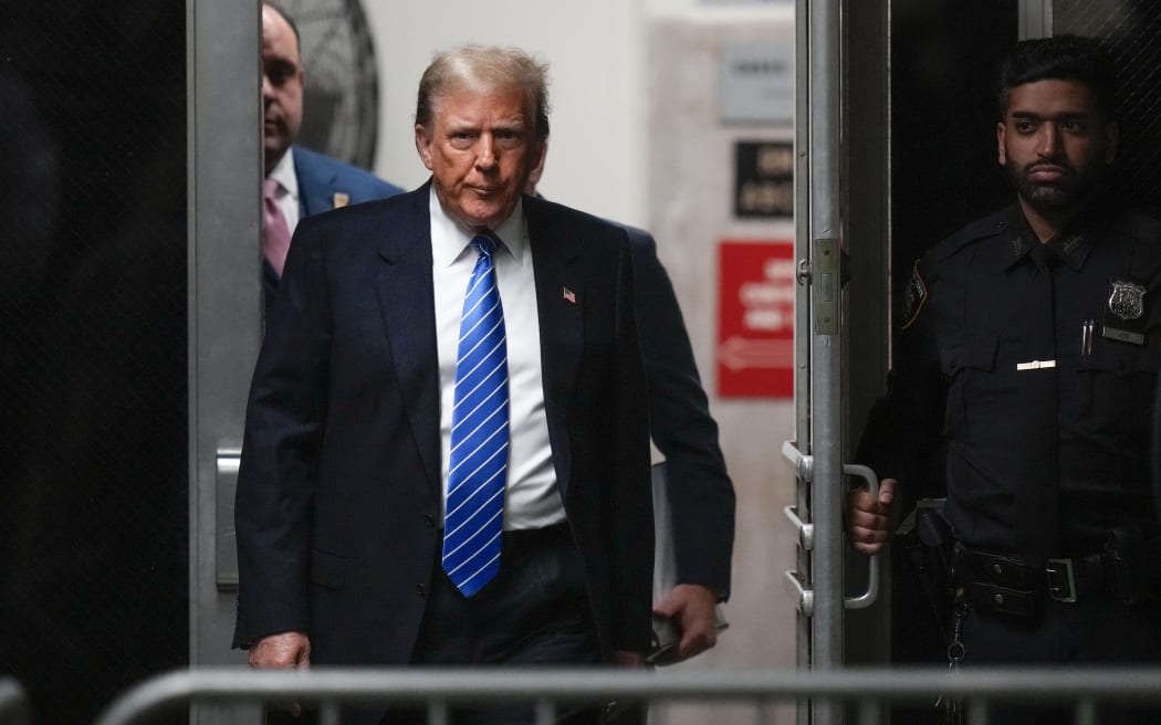NEW YORK, NEW YORK - MAY 13: Former U.S. President Donald Trump returns from break to court during his trial for allegedly covering up hush money payments at Manhattan Criminal Court on May 13, 2024 in New York City. Former U.S. President Donald Trump faces 34 felony counts of falsifying business records in the first of his criminal cases to go to trial.   Seth Wenig-Pool/Getty Images/AFP (Photo by POOL / GETTY IMAGES NORTH AMERICA / Getty Images via AFP)