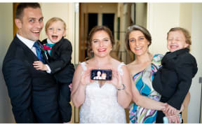 Helen Ellis and husband Clive on zoom to son's Chicago wedding