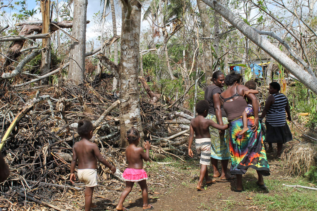Shaline Nimal walks through what is left of the village of Rangorango on Efate island, Vanuatu.