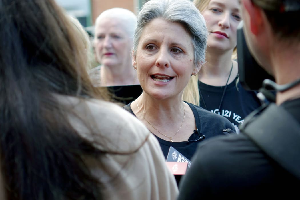 Laila Harre speaks to media before voting in the Epsom electorate on Suffrage Day.