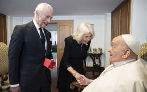 This photo taken on April 9, 2025 and handout on April 10, 2025 by The Vatican Media shows Pope Francis during a private meeting with Britain's King Charles III and Queen Camilla in The Vatican.