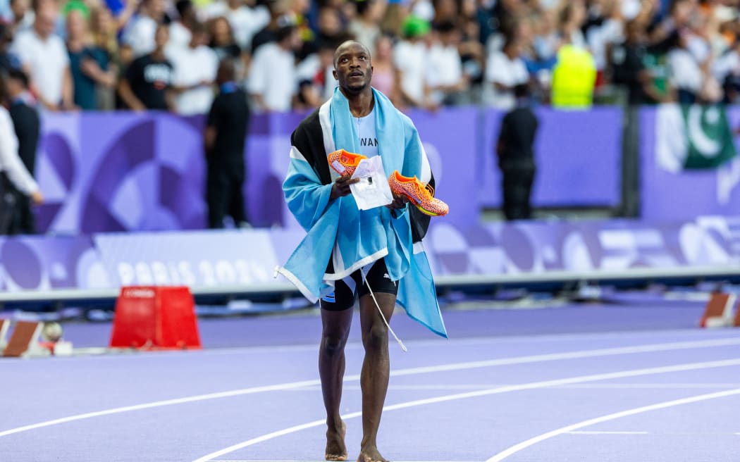 Letsile Tebogo of Team Botswana is celebrating  the gold medal in the Men's 200m Final on day thirteen of the Olympic Games Paris 2024 at Stade de France on August 08, 2024 in Paris, France. (Photo by Andrzej Iwanczuk/NurPhoto) (Photo by ANDRZEJ IWANCZUK / NurPhoto / NurPhoto via AFP)