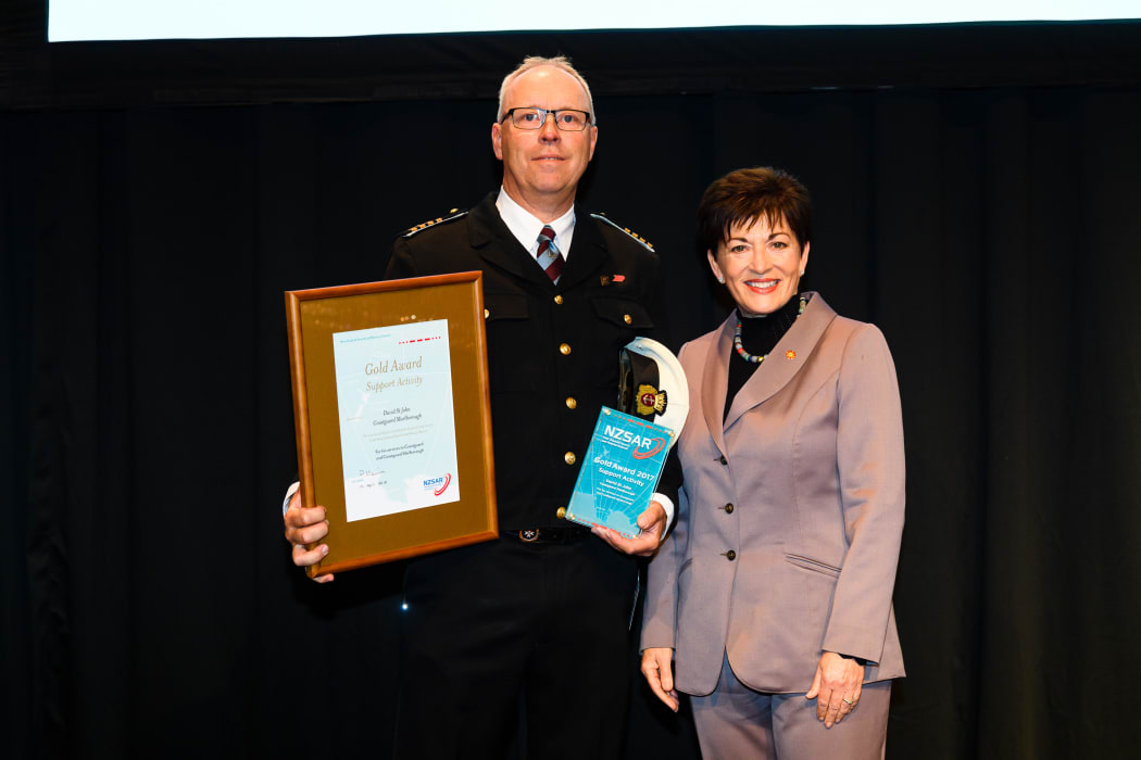 Gold Award winner. Dave St John with Dame Patsy Reddy.