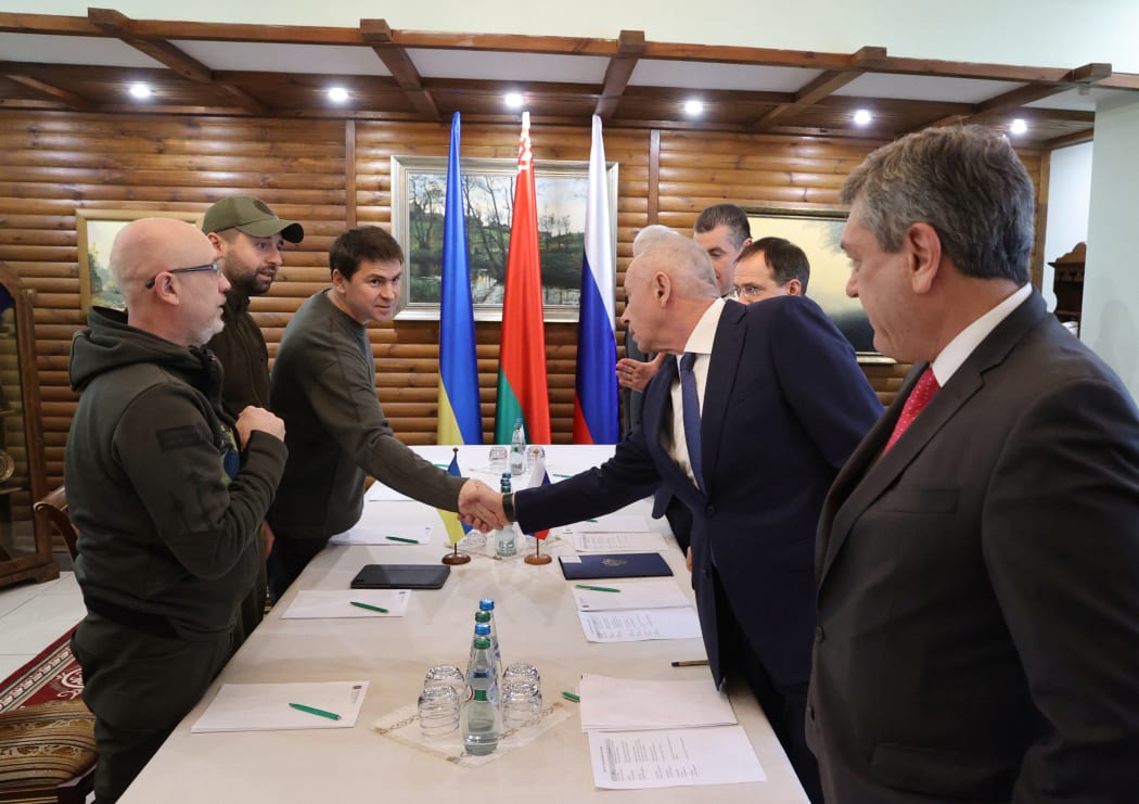 From left, members of Ukrainian delegation, Defence Minister Oleksii Reznikov, Davyd Arakhamia and Mykhailo Podoliyak and from right, members of Russian delegation Andrei Rudenko, Alexander Fomin, Vladimir Medinsky and Leonid Slutsky during Russian-Ukrainian talks, in Belarus.