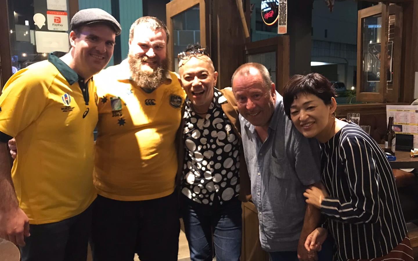 Dutch rugby fan Pierre Janssen (L) makes some new friends in Japan during the World Cup.