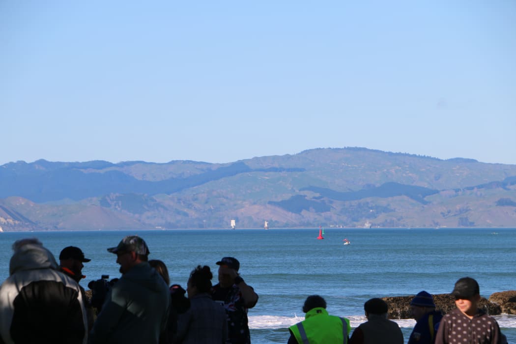 The Endeavour and the other tall ships sailed around past Te Kuri around 8am as onlookers gathered at Waikanae Beach to get a glimpse.