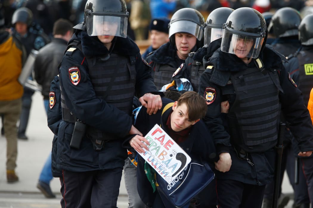 Russian riot police detain protesters during an opposition rally on March 26, 2017 in Moscow.