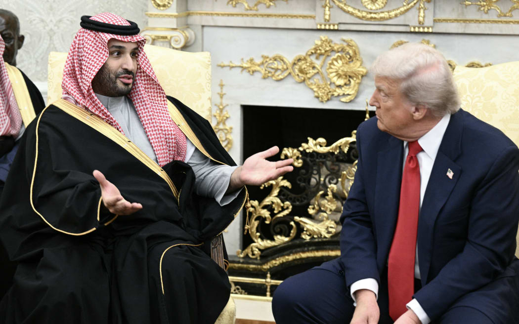 Crown Prince and Prime Minister of the Kingdom of Saudi Arabia Mohammed bin Salman speaks during a meeting with US President Donald Trump in the Oval Office of the White House in Washington, DC on November 18, 2025. Saudi Crown Prince Mohammed bin Salman arrived at the White House to fanfare and a jet flyover Tuesday, in his first visit to the United States since the 2018 murder of journalist Jamal Khashoggi. (Photo by Brendan SMIALOWSKI / AFP)