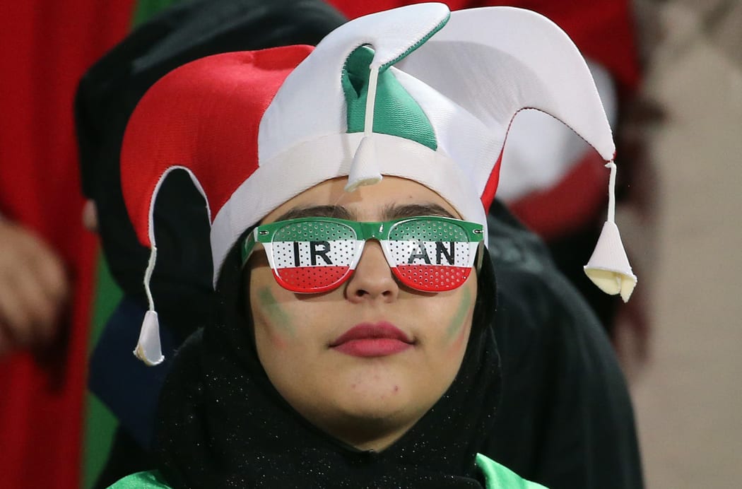 A female football fan at Iran's World Cup qualifier against Cambodia, in Teheran.  Iran has barred female spectators from football and other stadiums for around 40 years.
