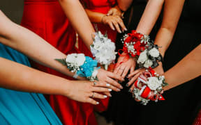 Corsages being worn by students at a school ball.