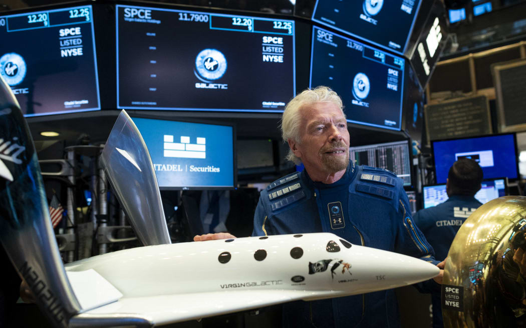 Richard Branson, Founder of Virgin Galactic poses before ringing the First Trade Bell to commemorate the Virgin Galactic's first day of trading on the New York Stock Exchange