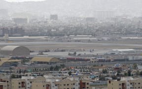 Military helicopters standing on the tarmac at a military airport in Kabul.