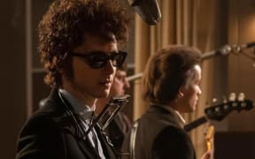 Timothée Chalamet as Bob Dylan in A Complete Unknown.