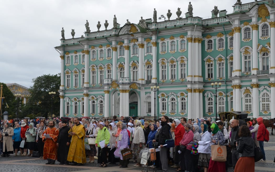 Orthodox supporter of the former Russian monarchy gather outside former Winter Palace in St Petersburg