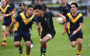 Southern Cross Campus' William Fakatoumafi evades James Cook High School during their match at the National Secondary School Championships in Takinini.