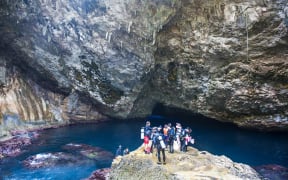 Divers preparing for dive in the grotto collapsed cave on Saipan, Northern Marianas, Central Pacific, Pacific (Photo by Michael Runkel / Robert Harding Premium / robertharding via AFP)