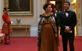 New Zealand's Prime Minister Jacinda Ardern (L) arrives to attend The Queen's Dinner during The Commonwealth Heads of Government Meeting (CHOGM), at Buckingham Palace in London on April 19, 2018.