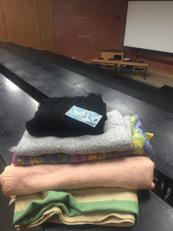 University of Waikato Te Kotahi Research Institute director Leonie Pihama, of Te Atiawa, presented $10 and four or five blankets to Victoria University.