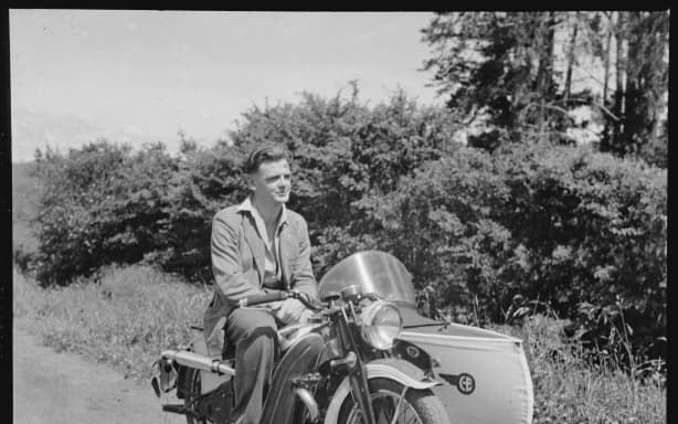 Ron Vine sitting on a motorcycle sidecar combination