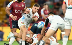 Cortez Ratima (centre) of the Chiefs in action during the Super Rugby Pacific Round 3 match between the Queensland Reds and the Chiefs at Suncorp Stadium in Brisbane, Saturday, March 9, 2024. (AAP Image/Darren England / www.photosport.nz)