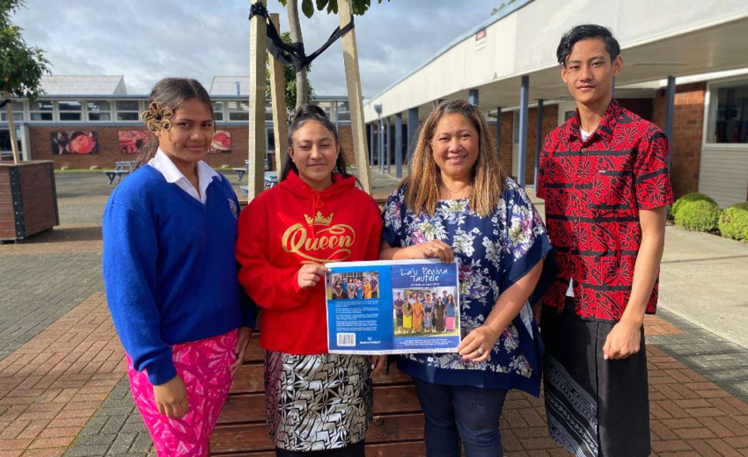 Tangaroa College students, from left, Petala Nanai, Fipule Tanavasa, and Togisau Chan Sau, with their English teacher Debbie Riley holding the cover of their book.