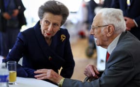 Britain's Princess Anne, Princess Royal (L) speaks with a veteran prior to attend a service of commemoration at Bayeux Cemetery, in Bayeux, Normandy, northwestern France, as part of the events to mark the 80th anniversary commemorations of Allied amphibious landing (D-Day Landings) in France in 1944, on June 5, 2024. Heads of state and veterans are due to mark the anniversary of D-Day on June 6, a date that was key to Allied Europe's eventual victory against the Nazis in World War II. (Photo by Hannah McKay / POOL / AFP)