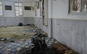 This handout photograph released by the official Syrian Arab News Agency (SANA) on December 26, 2025, shows the aftermath of the explosion inside Imam Ali ibn Abi Talib Mosque in the Wadi al-Dahab neighborhood of Homs. A deadly explosion hit a mosque in a predominantly Alawite area of Syria's Homs on December 26, said authorities who reported at least six people killed. "A terrorist explosion targeted the Ali Bin Abi Talib Mosque during Friday prayers in Al-Khadri Street in the Wadi al-Dahab neighbourhood of Homs," the interior ministry said in a statement, adding that six people were killed and 21 others wounded. (Photo by HANDOUT / SANA / AFP) / RESTRICTED TO EDITORIAL USE - MANDATORY CREDIT "AFP PHOTO / SANA " - HANDOUT - NO MARKETING NO ADVERTISING CAMPAIGNS - DISTRIBUTED AS A SERVICE TO CLIENTS