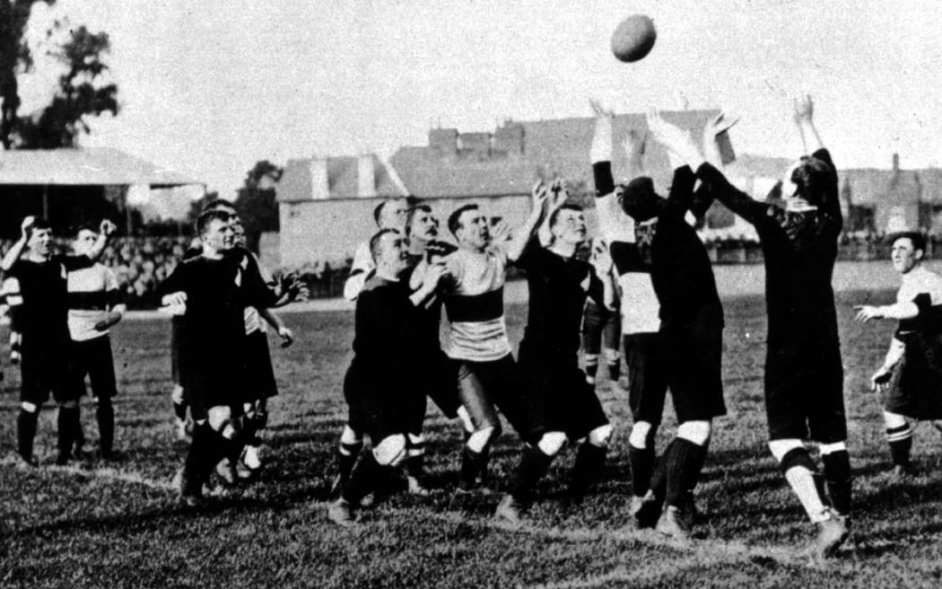 Dave Gallaher throws to a lineout.
Gallaher was captain of the original All Black team represented the All Blacks 1903-1906. He was killed in battle in 1917.
